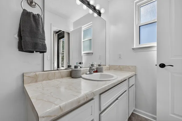 an aerial view of a house with a garden and swimming pool