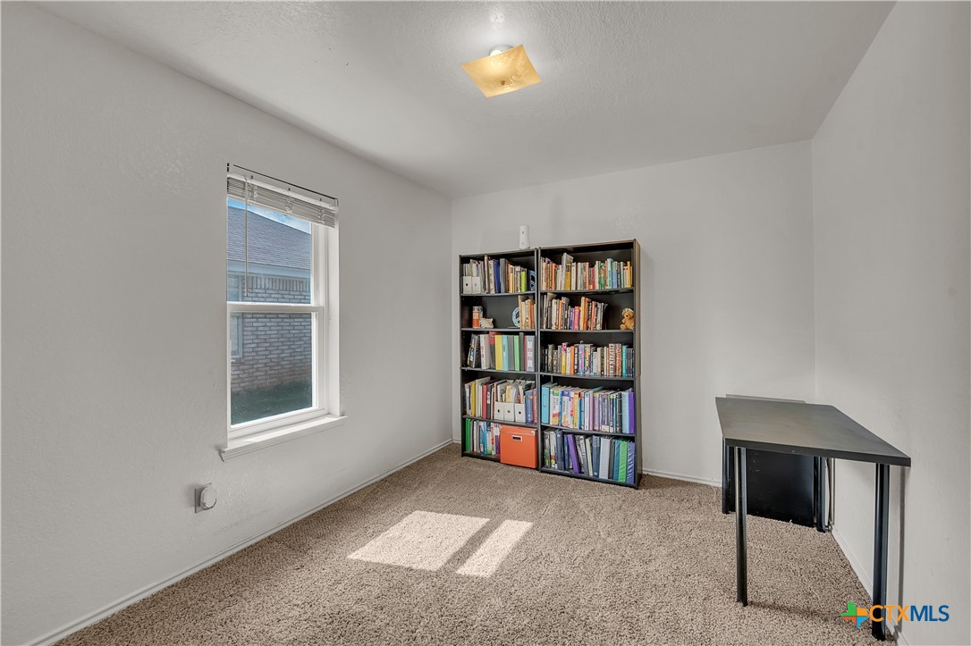 2002 Basalt Drive Killeen, TX 76549 - Photo 11 of 15 a view of an empty room with a window and a bookshelf