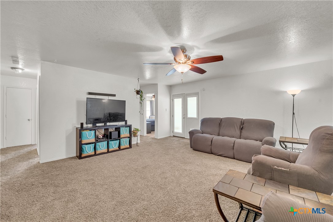2002 Basalt Drive Killeen, TX 76549 - Photo 2 of 15 a living room with furniture and a flat screen tv