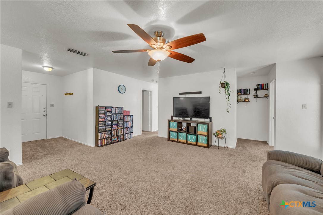 2002 Basalt Drive Killeen, TX 76549 - Photo 3 of 15 a living room with furniture and a flat screen tv