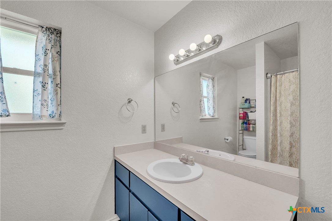 2002 Basalt Drive Killeen, TX 76549 - Photo 8 of 15 a bathroom with a sink and a mirror