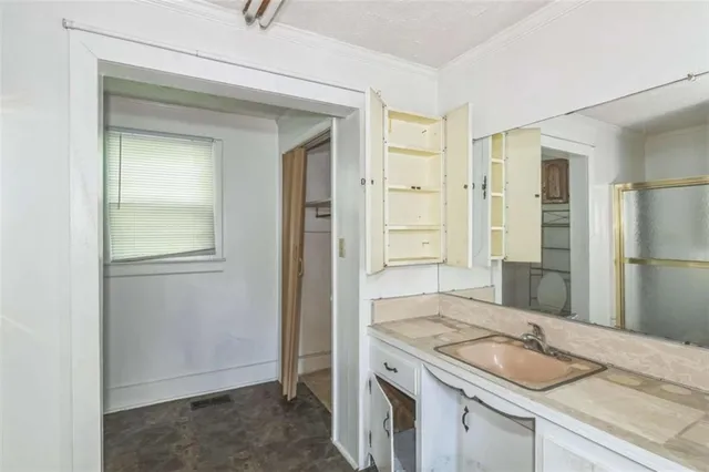 a view of an empty room with a window