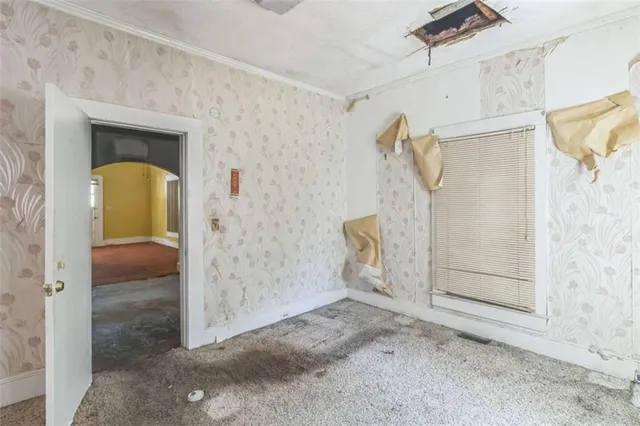 a bathroom with a toilet and shower