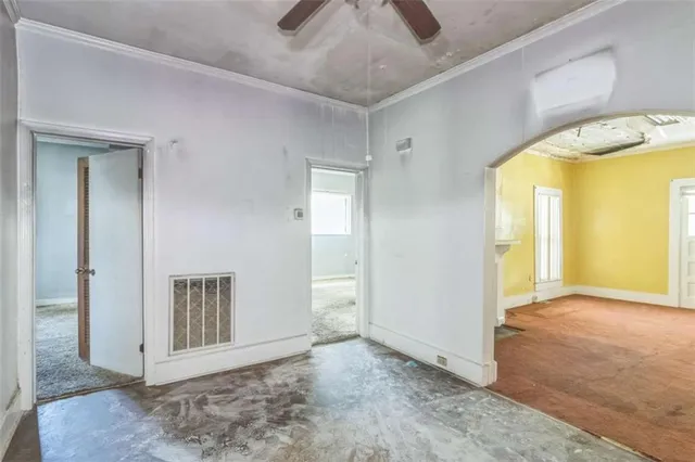 a balcony with furniture and a potted plant