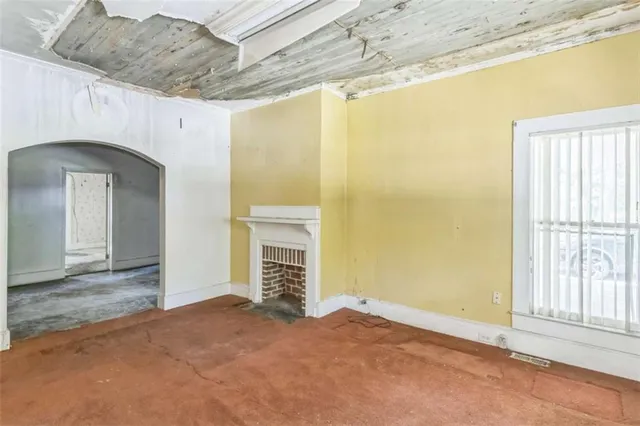 a view of a balcony with wooden floor and fence