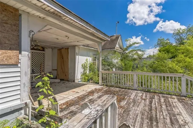 a view of a swimming pool with an outdoor seating and a yard