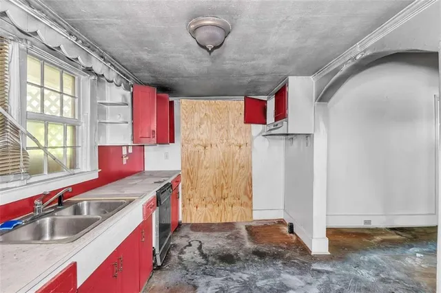 a kitchen with stainless steel appliances granite countertop a sink and a granite counter tops