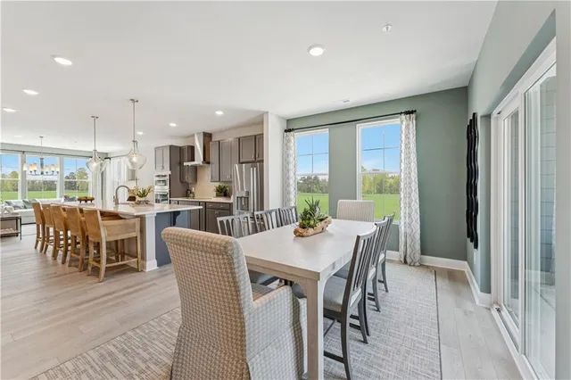 a view of a dining room with furniture window and outside view