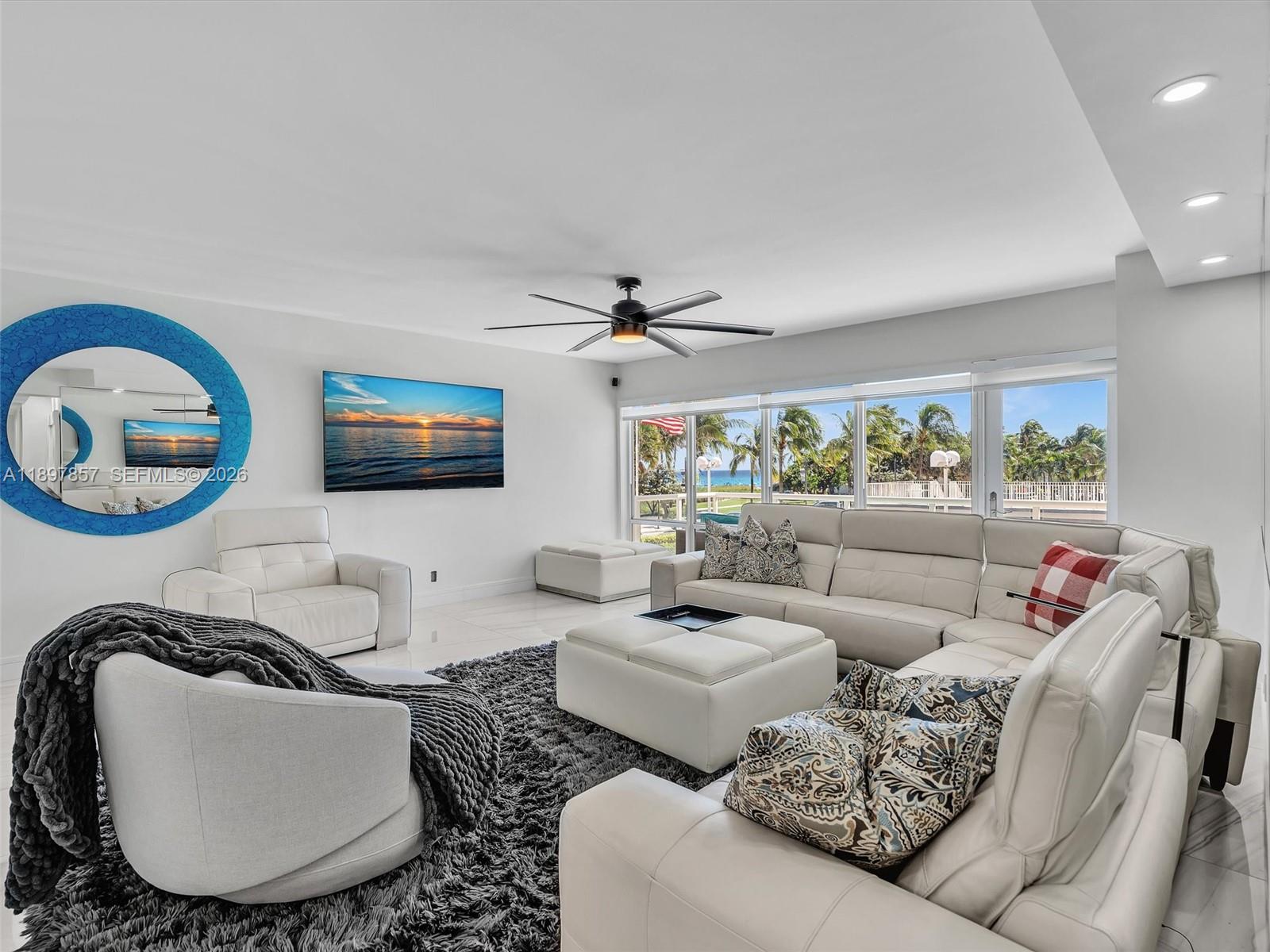 111 North Pompano Beach Boulevard, Unit 308 Pompano Beach, FL 33062 - Photo 1 of 50 a living room with furniture and a window