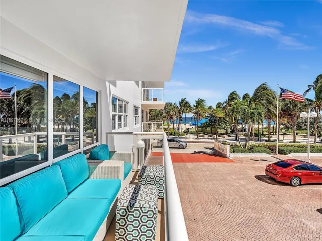 a view of a swimming pool with lounge chairs