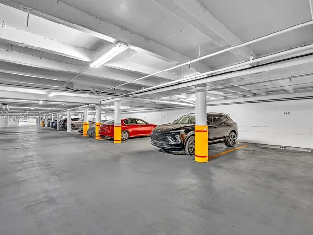 a view of parking garage with cars