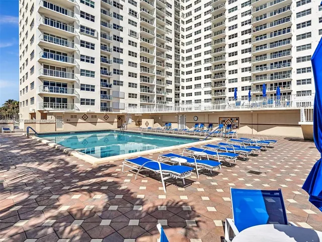 a view of a swimming pool with a patio