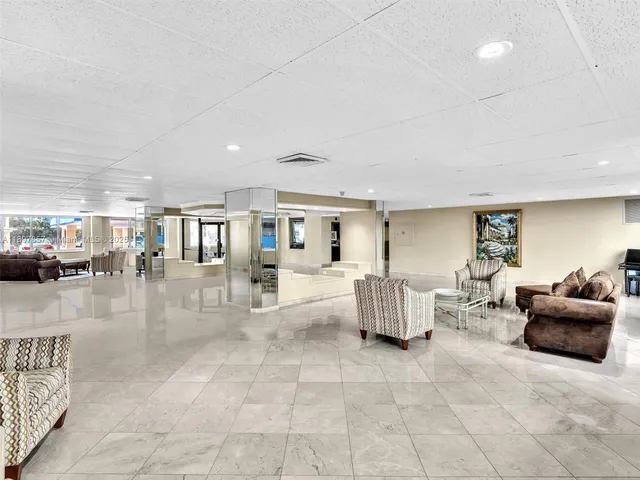 a living room with furniture and white walls