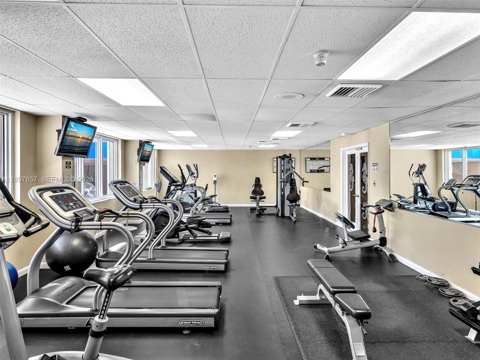 111 North Pompano Beach Boulevard, Unit 308 Pompano Beach, FL 33062 - Photo 37 of 50 a view of a room with gym equipment