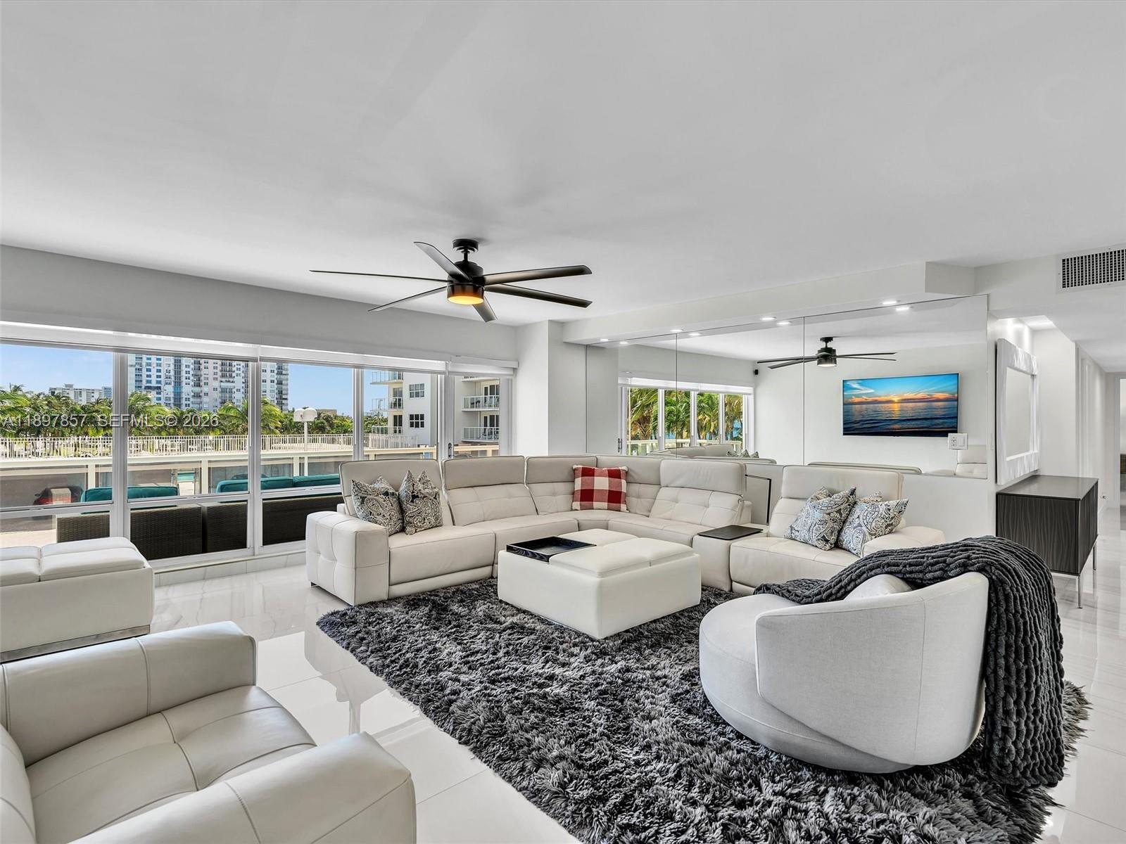 111 North Pompano Beach Boulevard, Unit 308 Pompano Beach, FL 33062 - Photo 5 of 50 a living room with furniture large windows and a view of living room