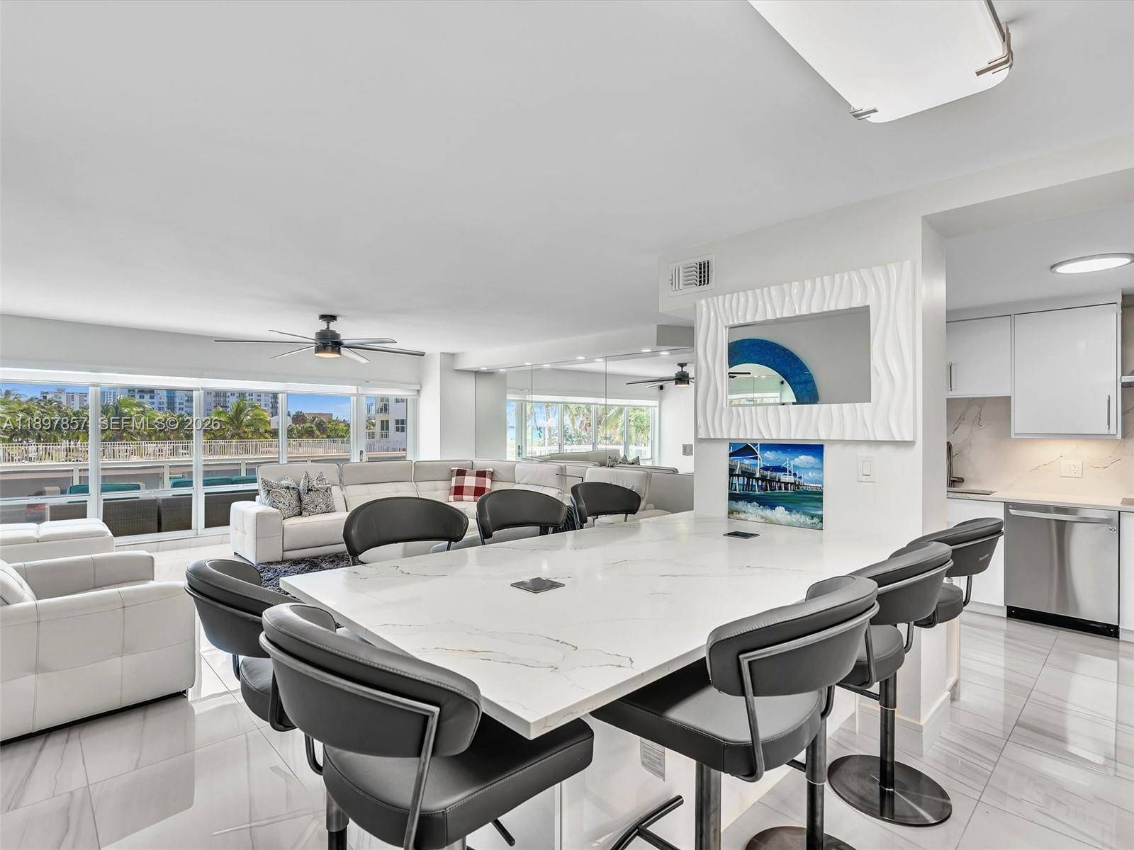 111 North Pompano Beach Boulevard, Unit 308 Pompano Beach, FL 33062 - Photo 10 of 50 a view of a dining room with furniture window and wooden floor