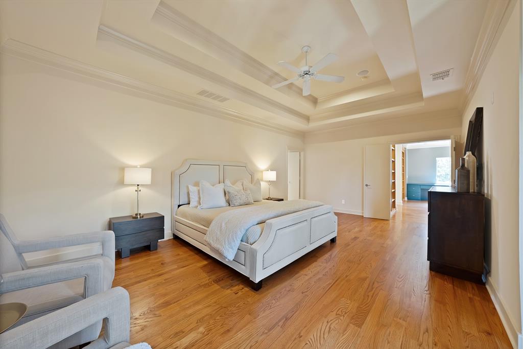 4010 Rawlins Street Dallas, TX 75219 - Photo 30 of 40 Bedroom with ornamental molding, light wood finished floors, and ceiling fan