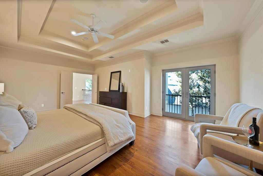 4010 Rawlins Street Dallas, TX 75219 - Photo 31 of 40 Bedroom with access to exterior, wood finished floors, ceiling fan, and french doors