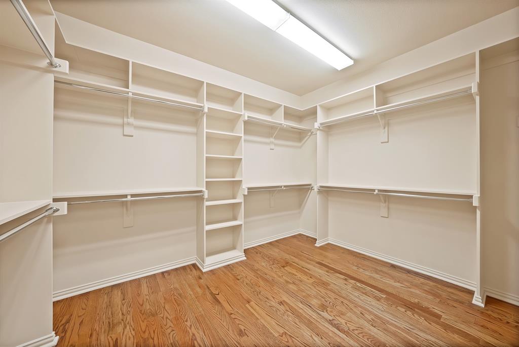 4010 Rawlins Street Dallas, TX 75219 - Photo 36 of 40 Walk in closet with light wood-type flooring
