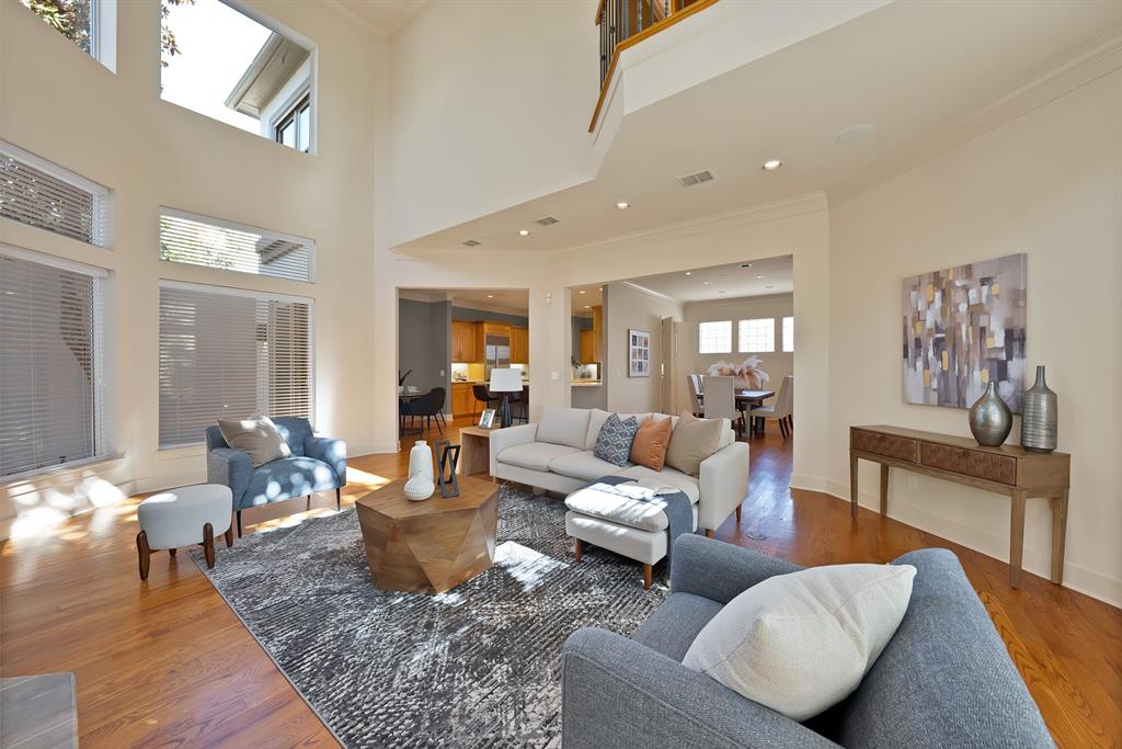 4010 Rawlins Street Dallas, TX 75219 - Photo 7 of 40 Living area featuring wood finished floors and ornamental molding