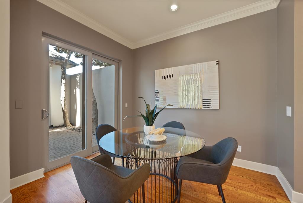 4010 Rawlins Street Dallas, TX 75219 - Photo 10 of 40 Dining space featuring wood finished floors, crown molding, and recessed lighting