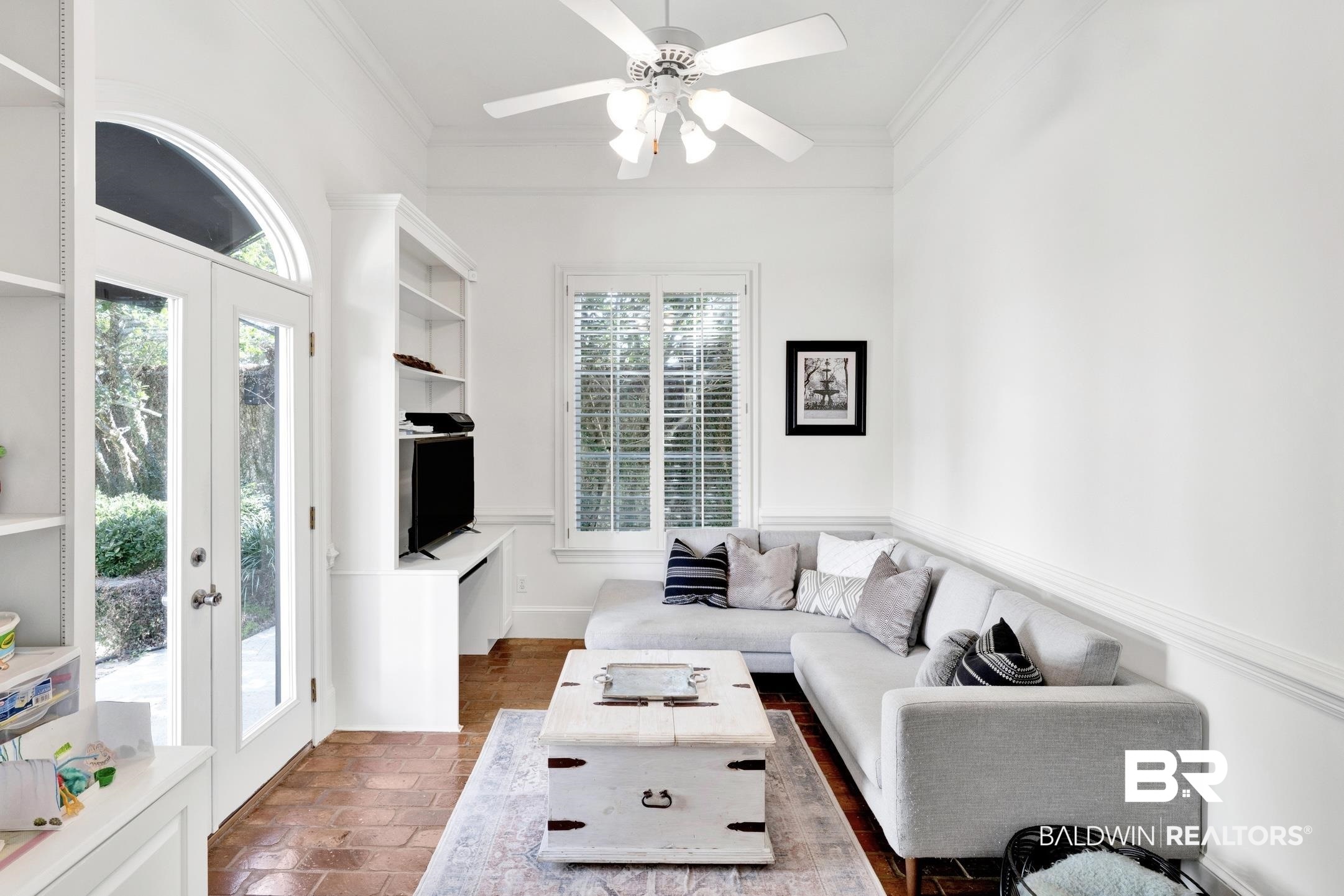 4 Savannah Court Mobile, AL 36608 - Photo 13 of 32 Living room featuring ceiling fan and crown molding
