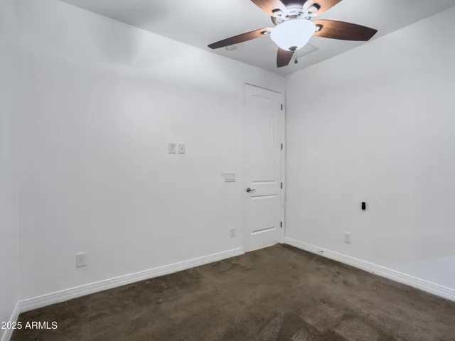 a view of an empty room with a flat screen tv