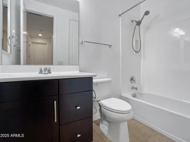 an empty room with a ceiling fan and a window