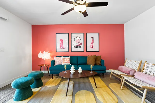 a living room with furniture and a rug