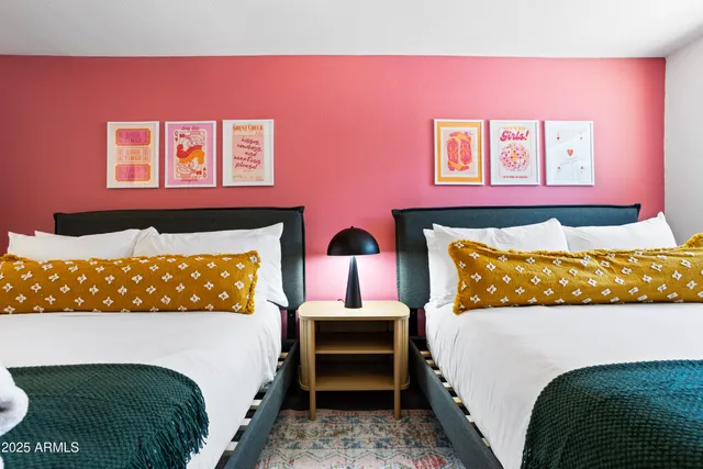 a bed room with a bed and a night stand