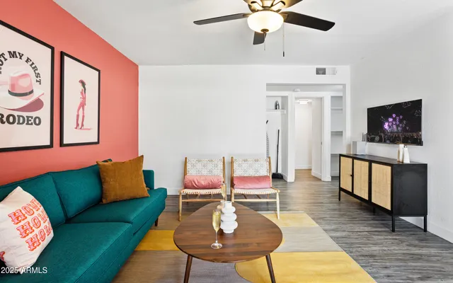 a living room with furniture and a flat screen tv