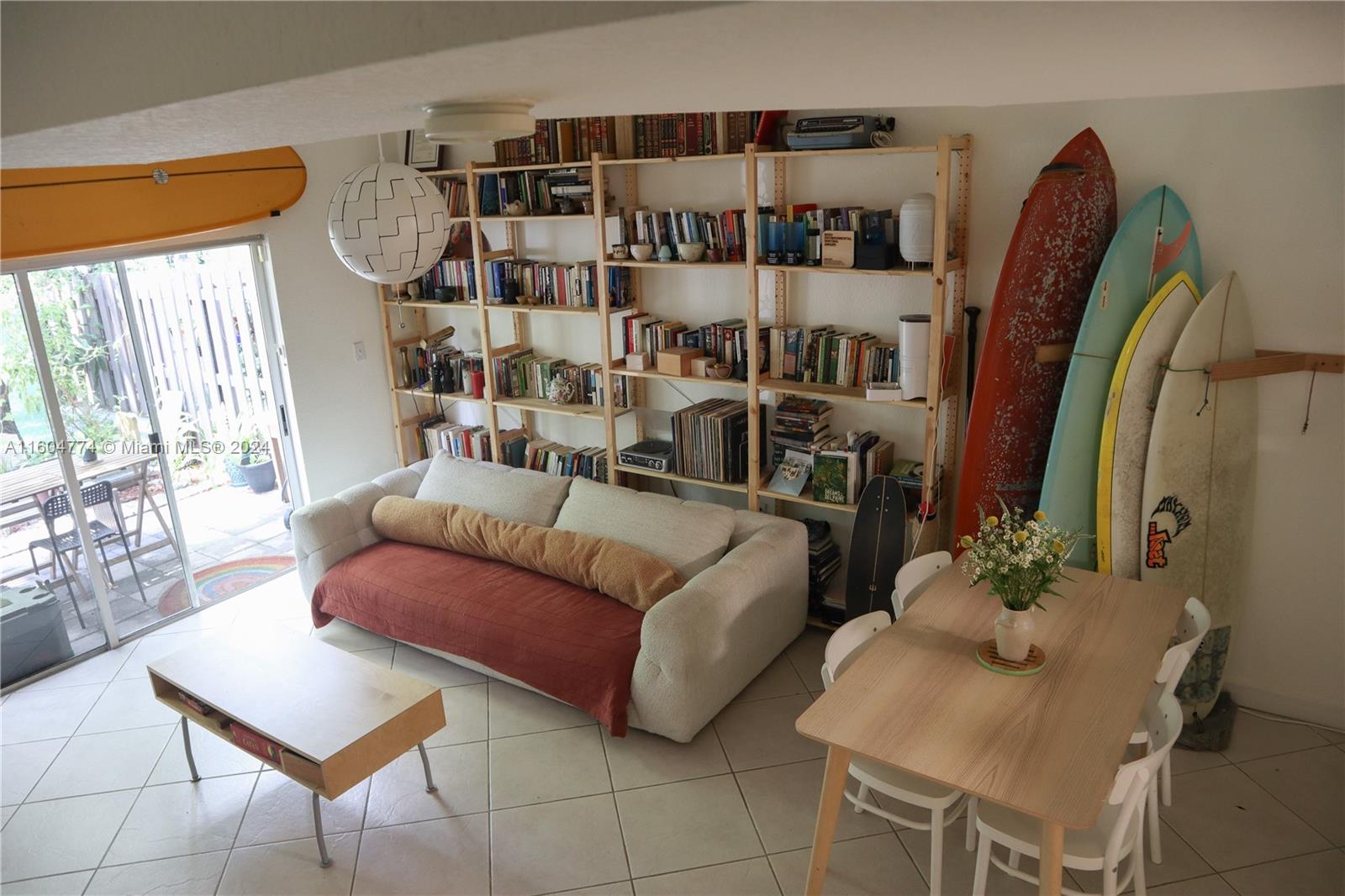 a living room with furniture a rug and a window