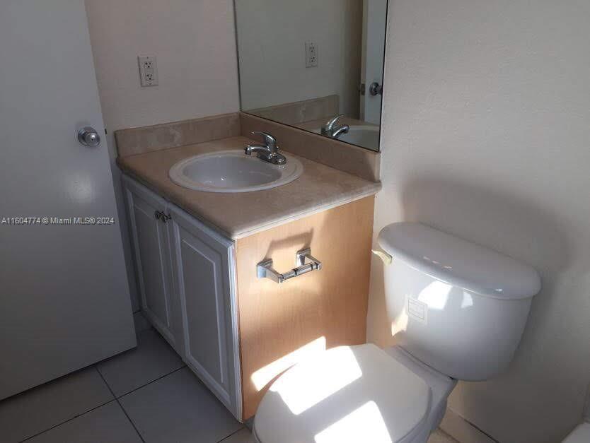 123 Southwest 17th Road, Unit 103 Miami, FL 33129 - Photo 15 of 21 a bathroom with a sink and a mirror