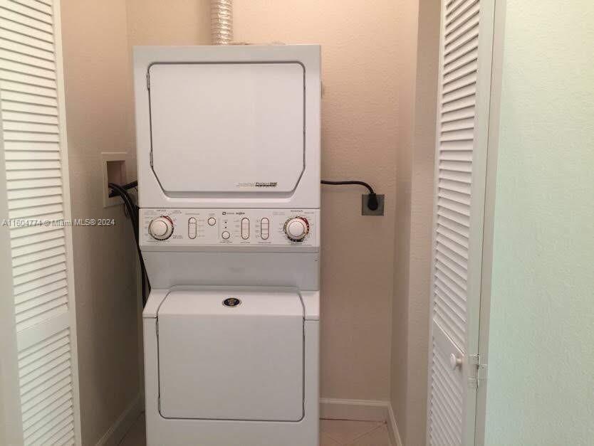 123 Southwest 17th Road, Unit 103 Miami, FL 33129 - Photo 16 of 21 a utility room with dryer and washer