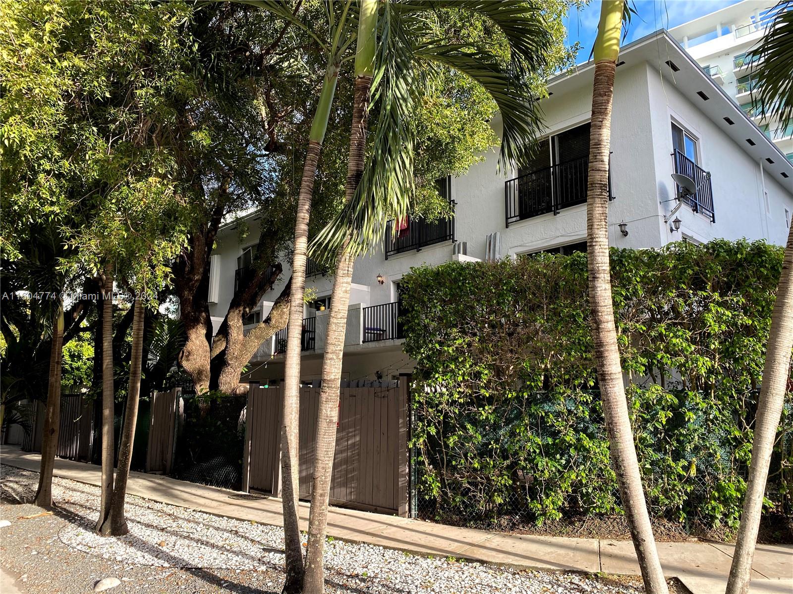 123 Southwest 17th Road, Unit 103 Miami, FL 33129 - Photo 18 of 21 a view of a house with a tree