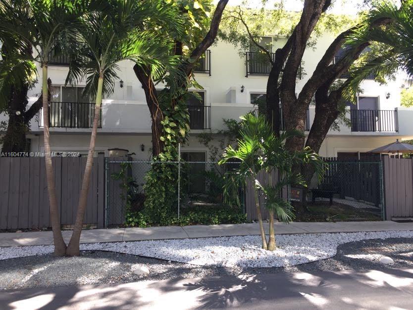 123 Southwest 17th Road, Unit 103 Miami, FL 33129 - Photo 2 of 21 a view of a house with a tree in front
