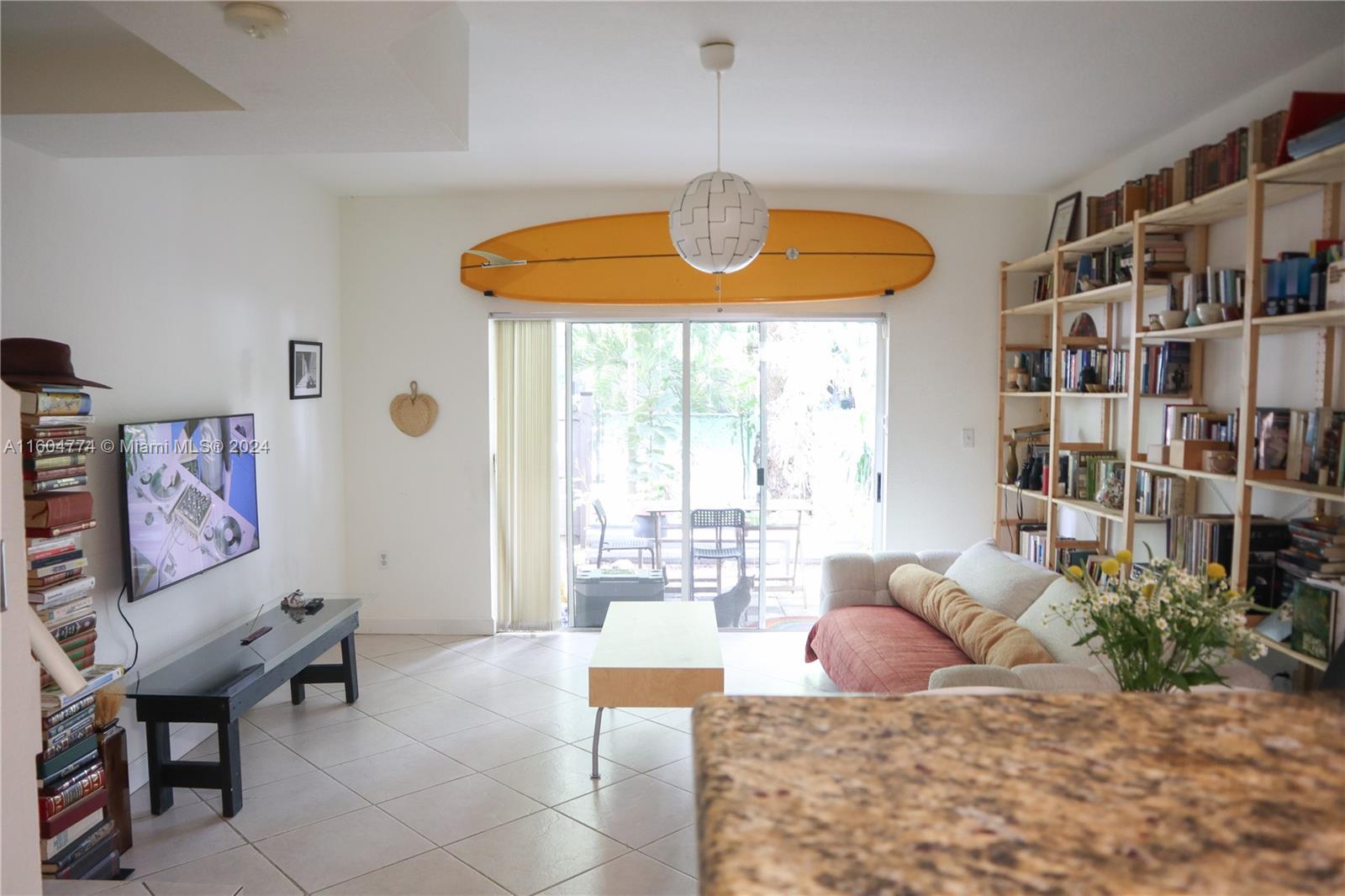 123 Southwest 17th Road, Unit 103 Miami, FL 33129 - Photo 7 of 21 a bedroom with furniture and a large window