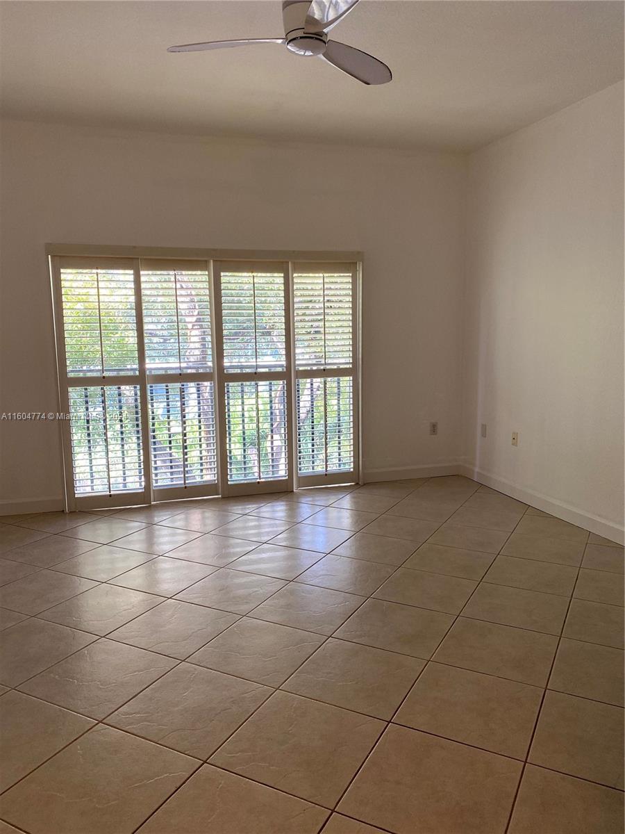 123 Southwest 17th Road, Unit 103 Miami, FL 33129 - Photo 10 of 21 a view of an empty room with a window