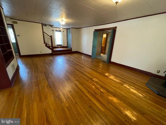 378 Tea Creek Road Reedsville, PA 17084 - Photo 13 of 41 a view of an empty room with wooden floor and a window
