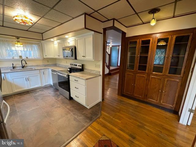 378 Tea Creek Road Reedsville, PA 17084 - Photo 7 of 41 a kitchen with stainless steel appliances granite countertop a stove a sink and a refrigerator