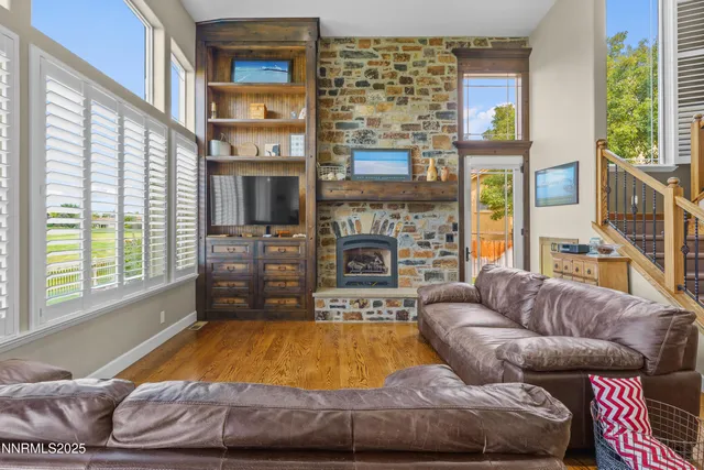 a dining room with a table chairs and a window