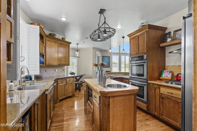 a bedroom with a bed window and wooden floor