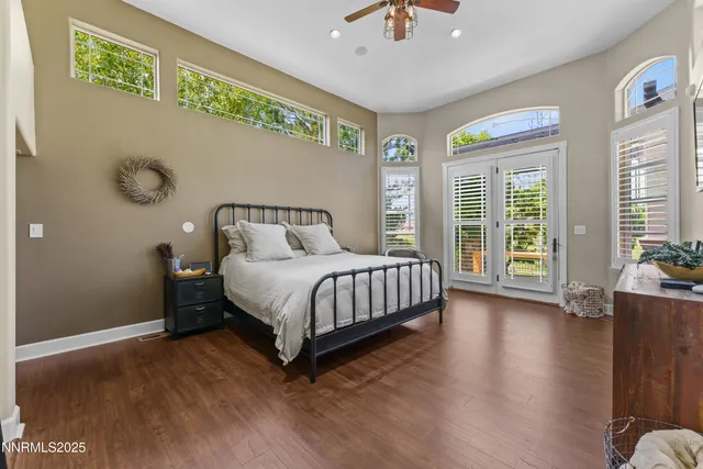 a bedroom with a bed chair and dresser