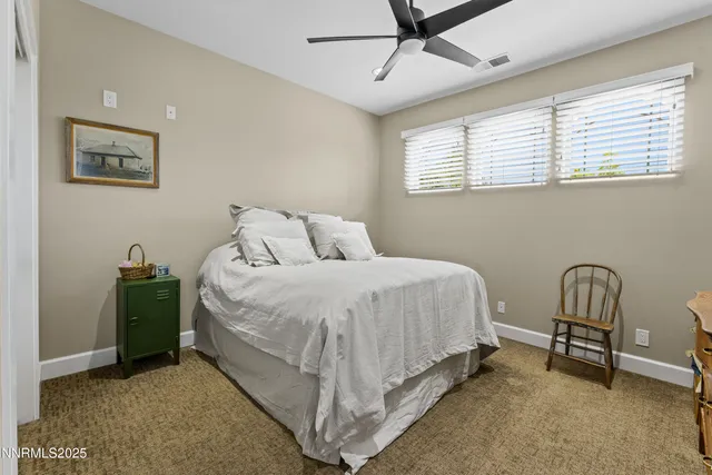 an aerial view of a house with outdoor space and a lake view