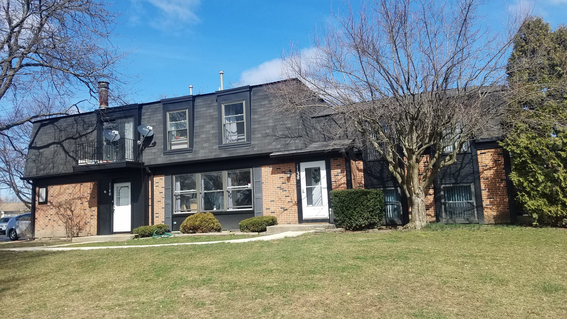 1216 Inverrary Lane, Unit 1216 Deerfield, IL 60015 - Photo 1 of 1 a view of a house with backyard and sitting area