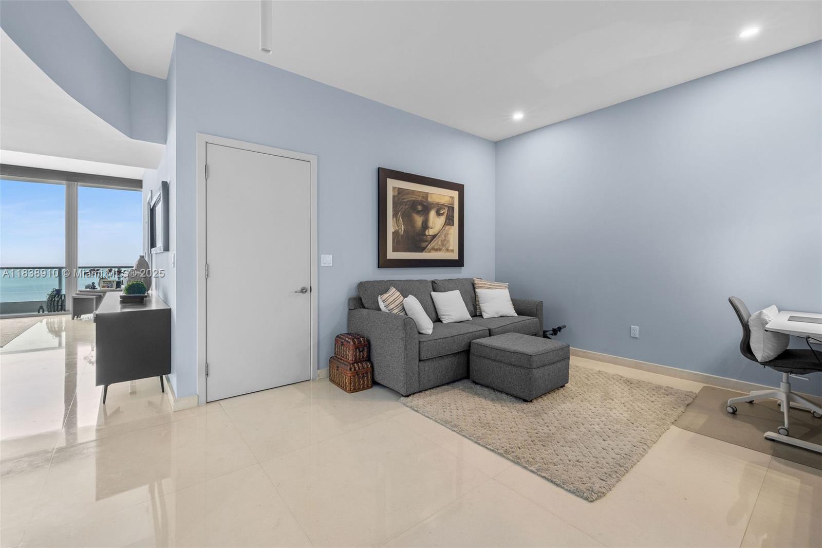 1331 Brickell Bay Drive, Unit 2909 Miami, FL 33131 - Photo 11 of 48 a living room with furniture and a table