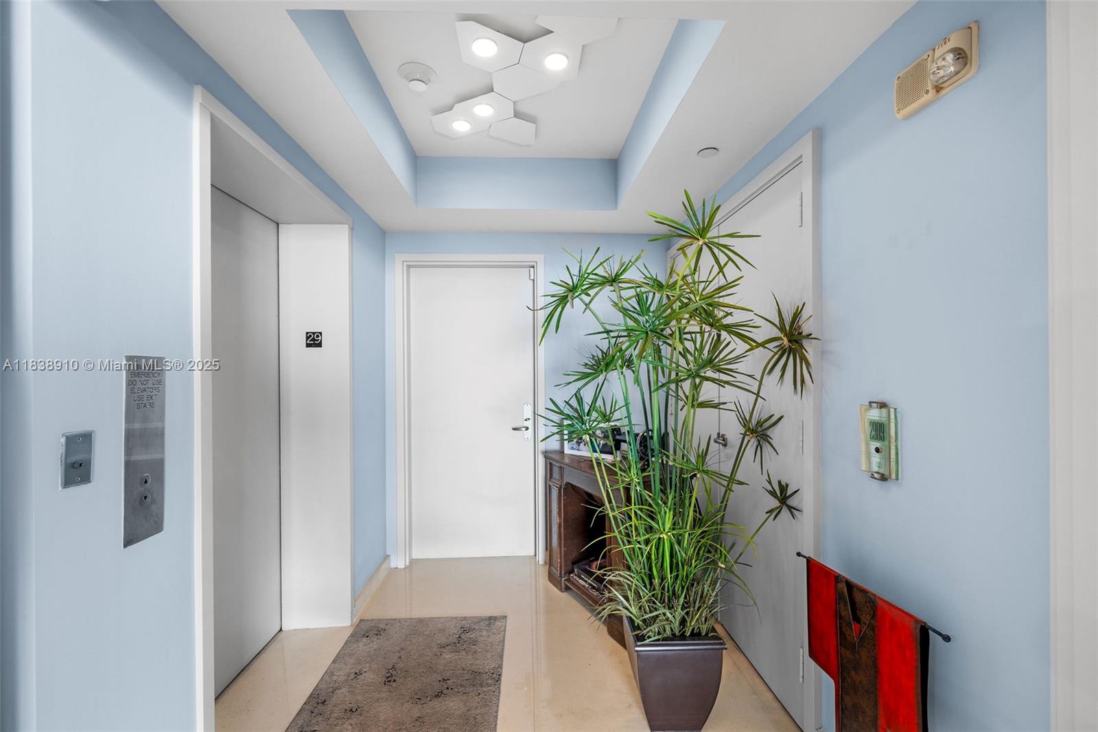 1331 Brickell Bay Drive, Unit 2909 Miami, FL 33131 - Photo 12 of 48 a plant in a vase with flowers