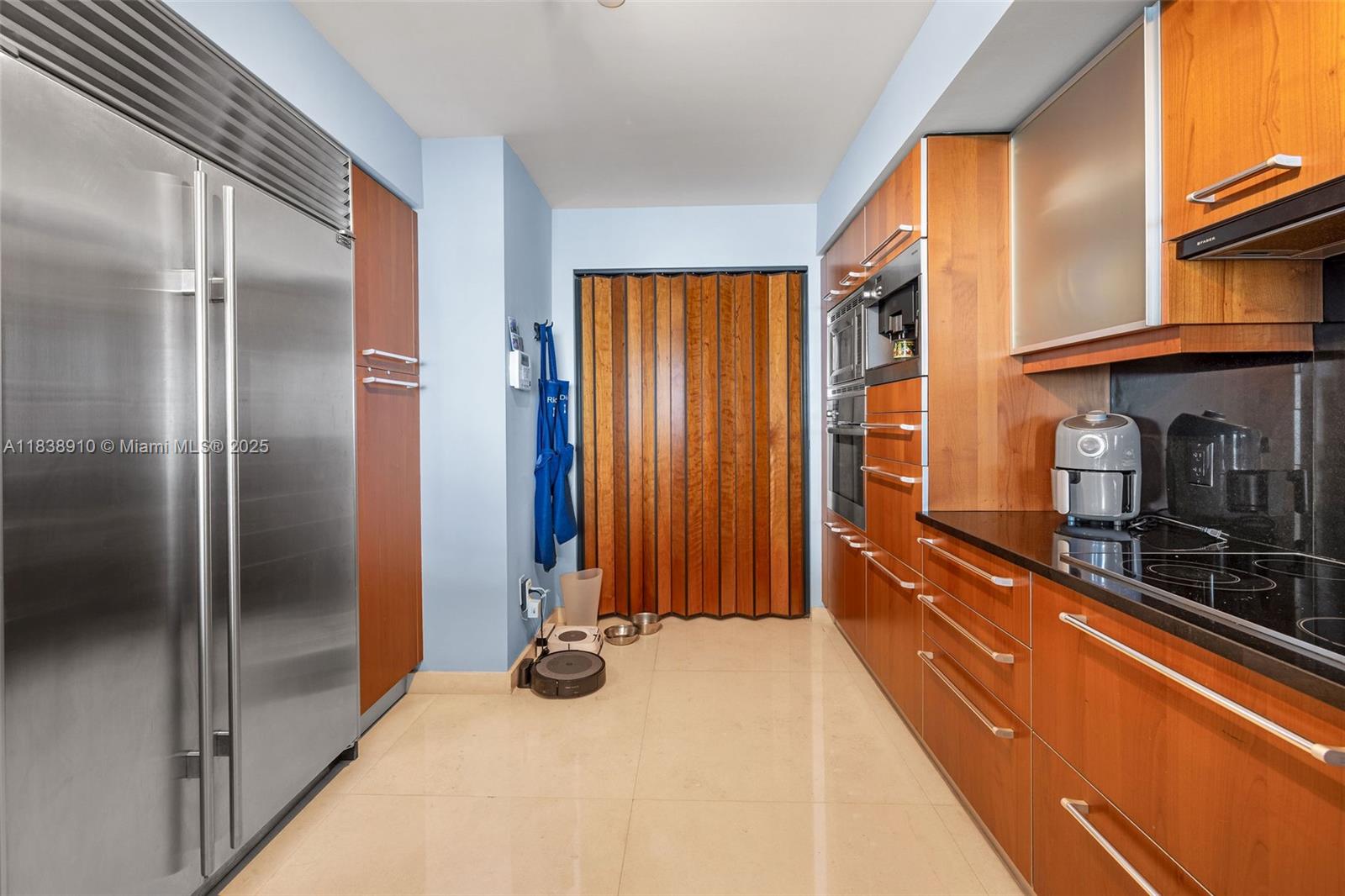 1331 Brickell Bay Drive, Unit 2909 Miami, FL 33131 - Photo 15 of 48 a view of a kitchen with stainless steel appliances granite countertop a sink and a refrigerator