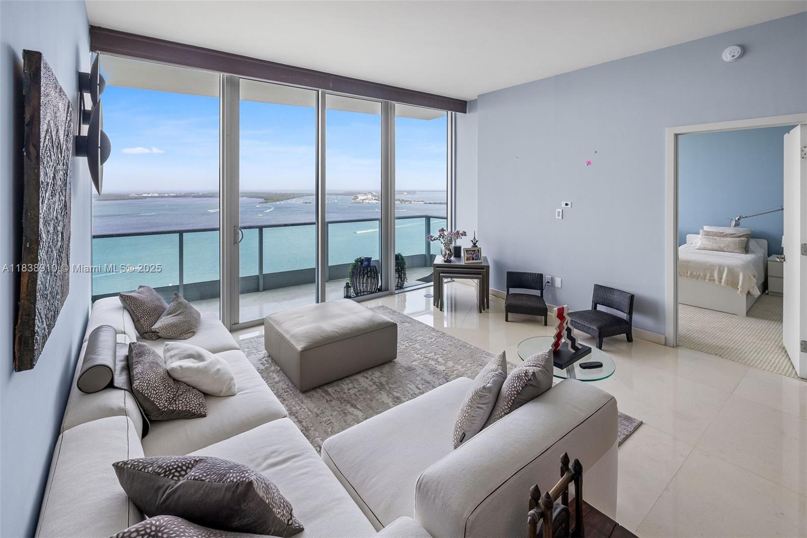 1331 Brickell Bay Drive, Unit 2909 Miami, FL 33131 - Photo 2 of 48 a living room with furniture and a large window