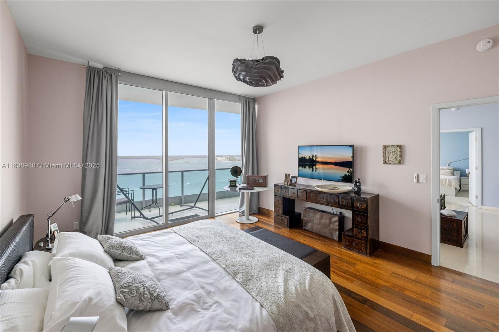 1331 Brickell Bay Drive, Unit 2909 Miami, FL 33131 - Photo 21 of 48 a bedroom with a bed and a large window